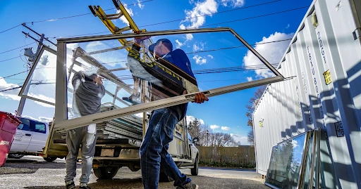 Commercial glazier working on scaffold installation